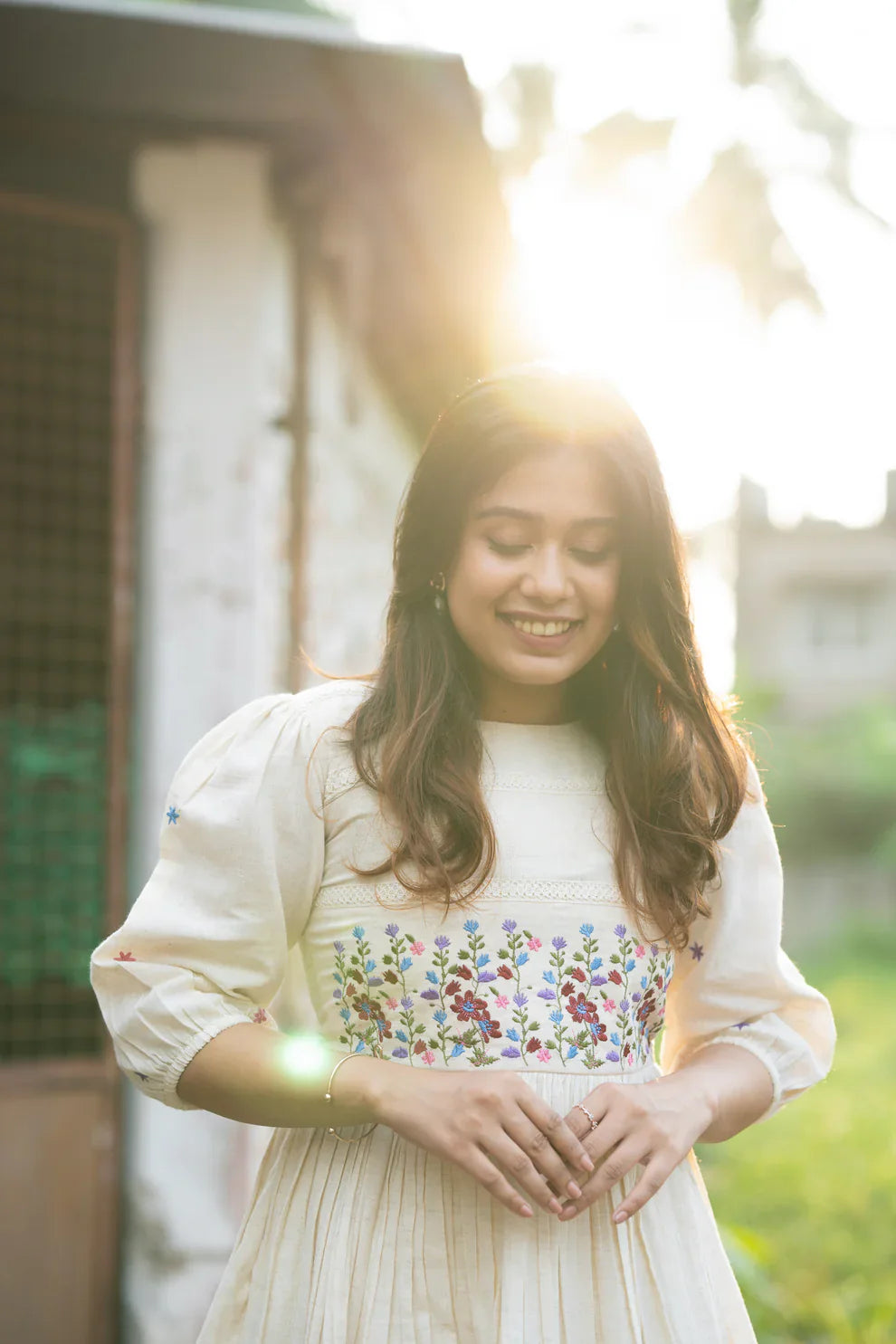 Off-white flex cotton dress with floral embroidery and crochet lace detailing on yoke and sleeves